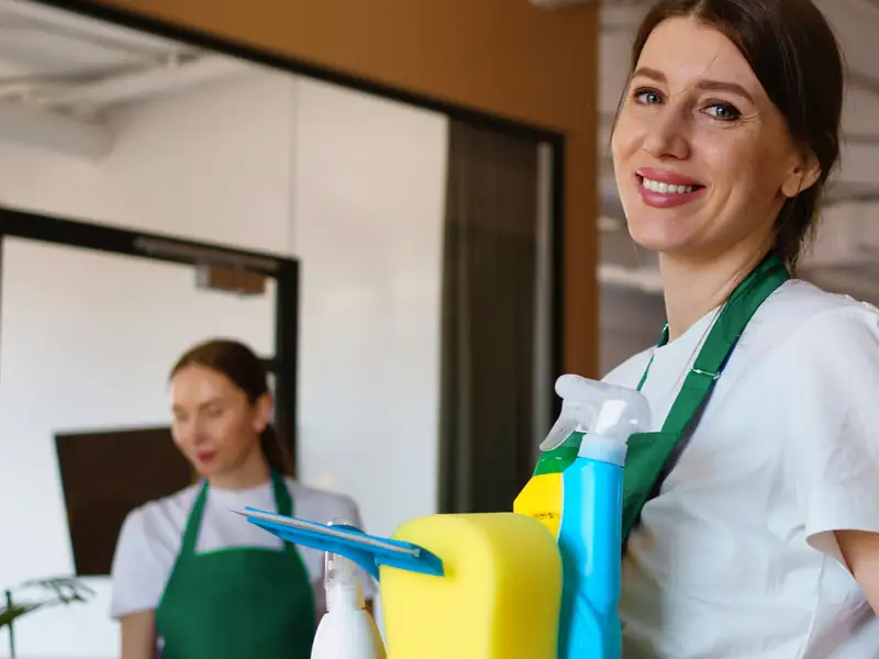Cleaner holding professional cleaning supplies for water tank cleaning