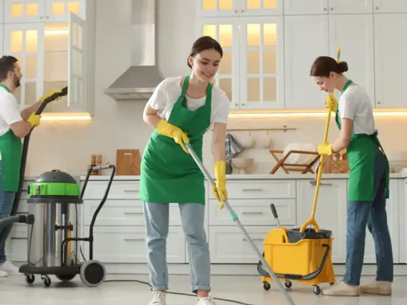 Professional cleaners doing home deep cleaning of a living room in Indore